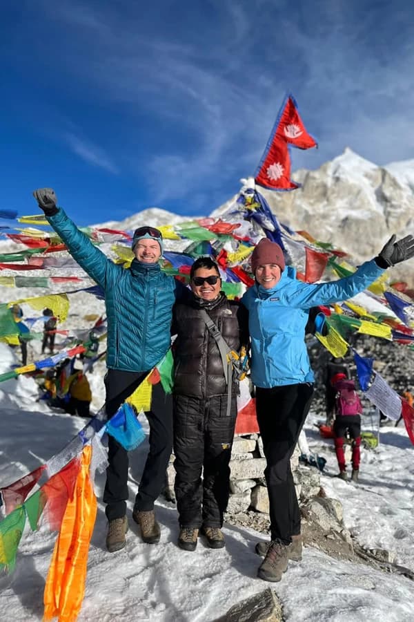 Happy trekkers pose at Tsergo Ri in Langtang